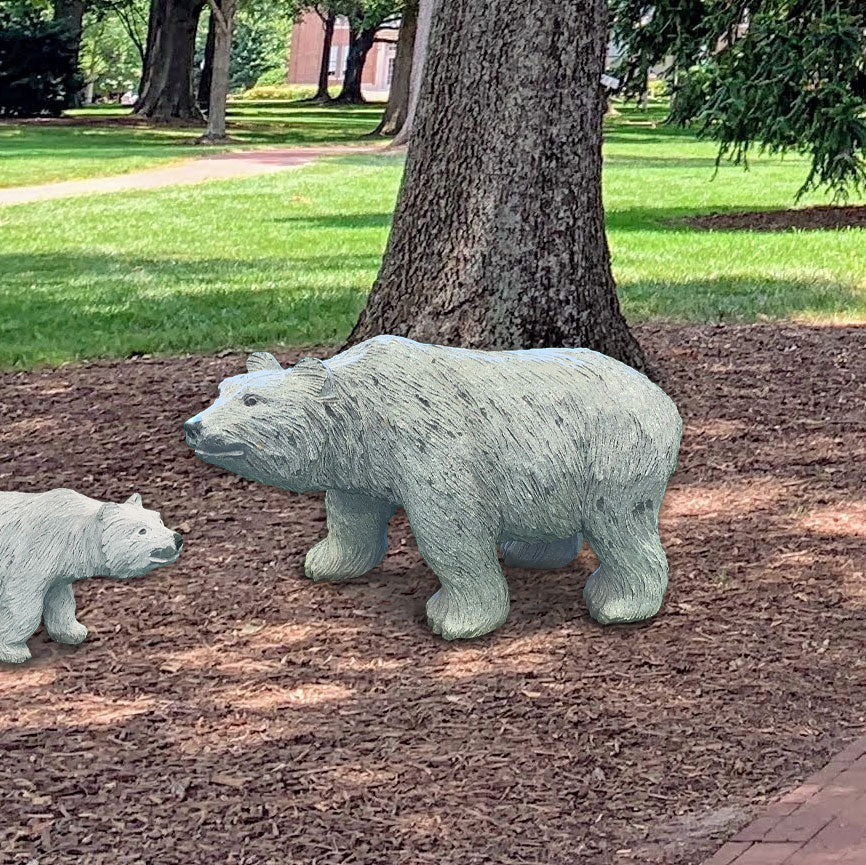 48&quot; granite bear sculpture with intricate details and polished accents placed outdoors.