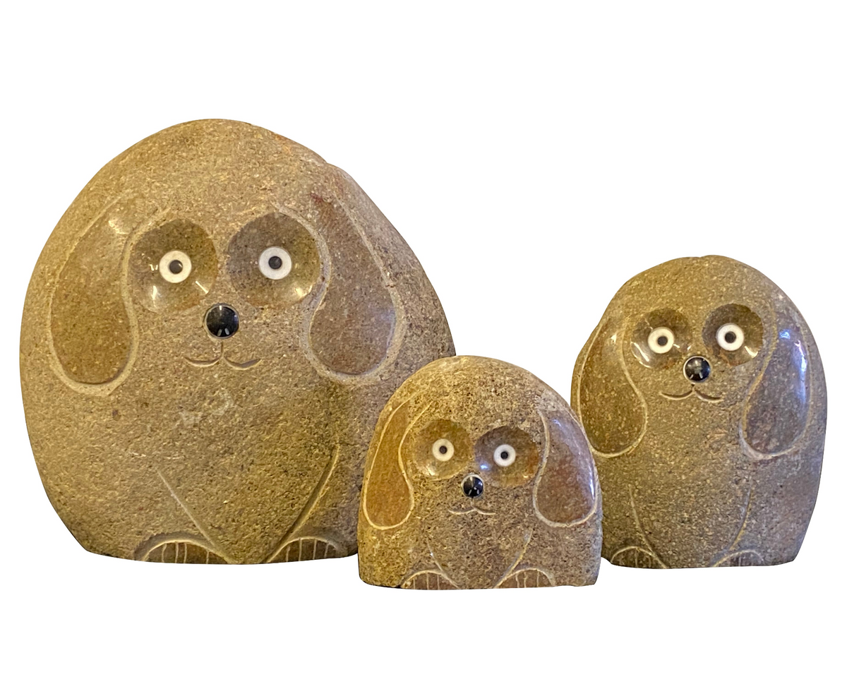 Family of hand-carved granite stone dogs in three sizes, perfect for home or garden decor.