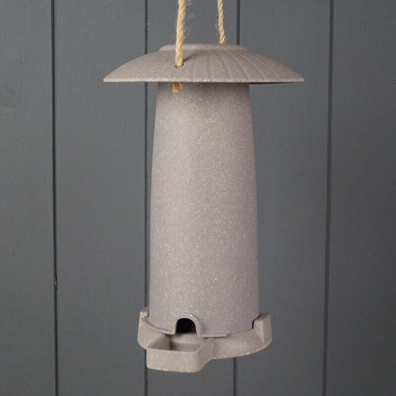 Earthy sustainable seed feeder made from straw, outdoor/indoor use, vegan-friendly.