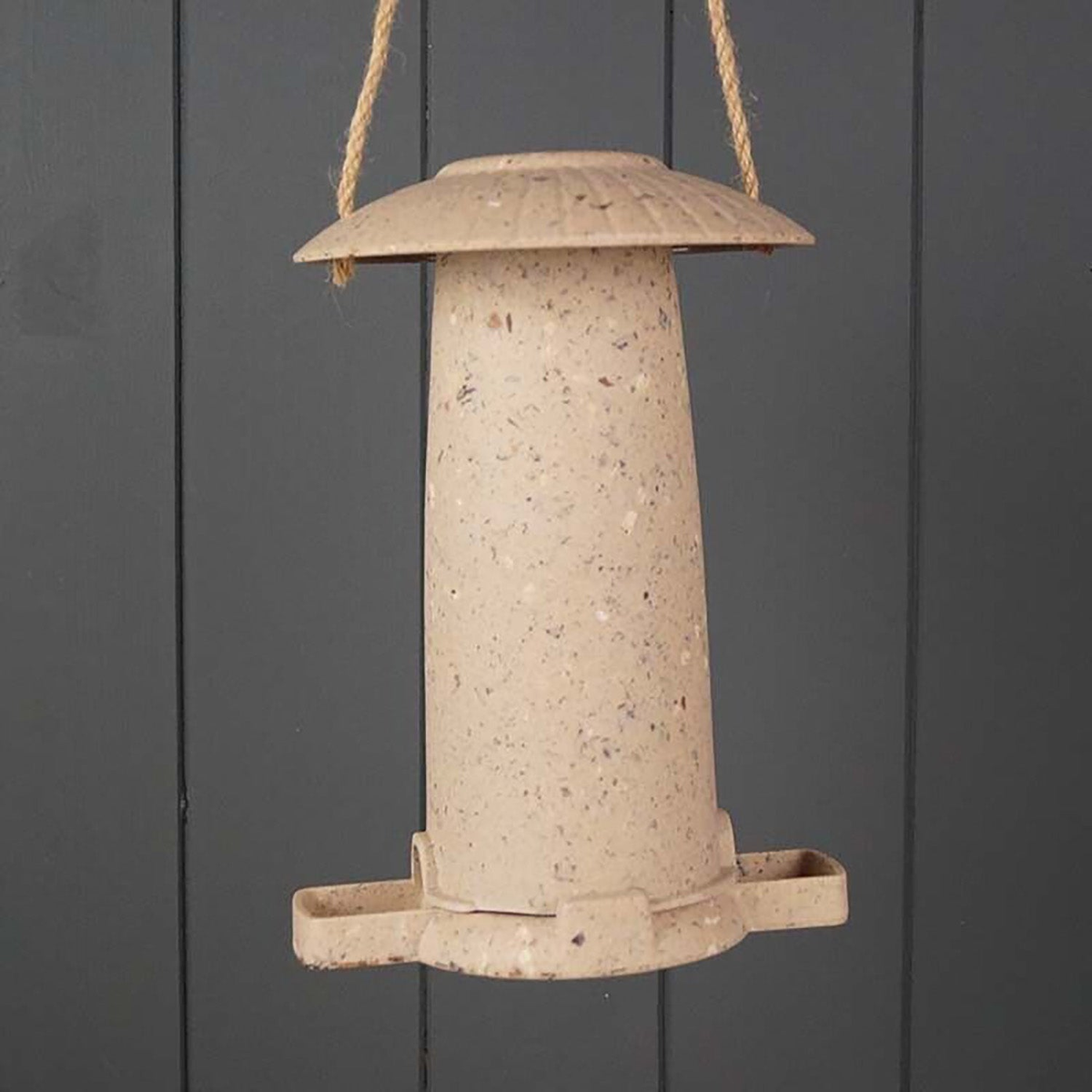 Earthy sustainable seed feeder made from coffee husks, dimensions 8.66&quot; x 5.71&quot; x 6.10&quot;, suitable for indoor and outdoor use.