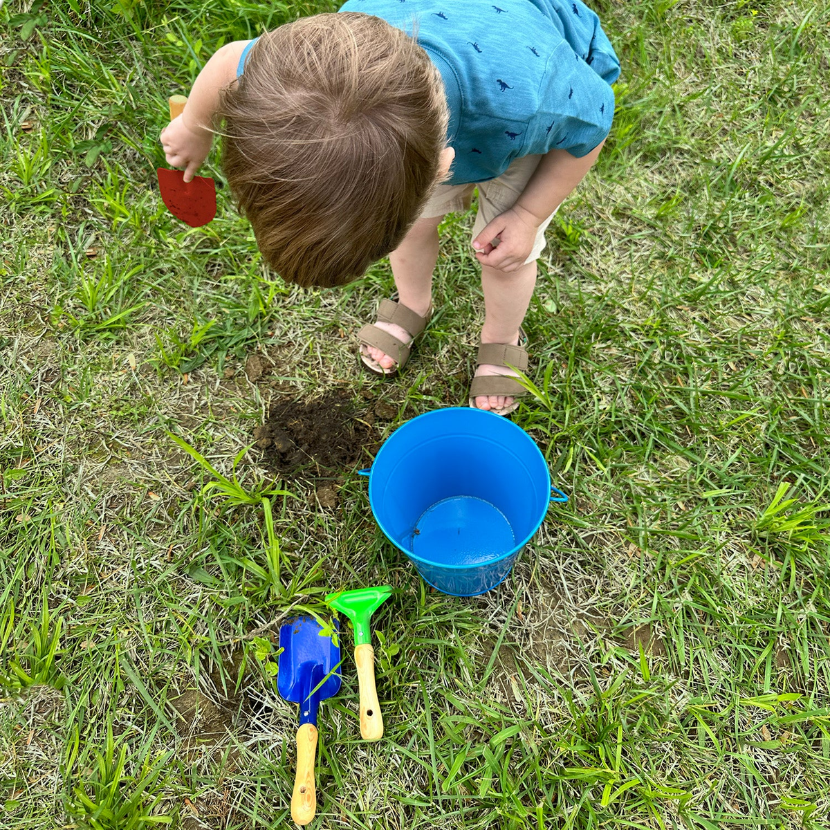 Small kids square trowel with vibrant primary color for gardening and sand play.