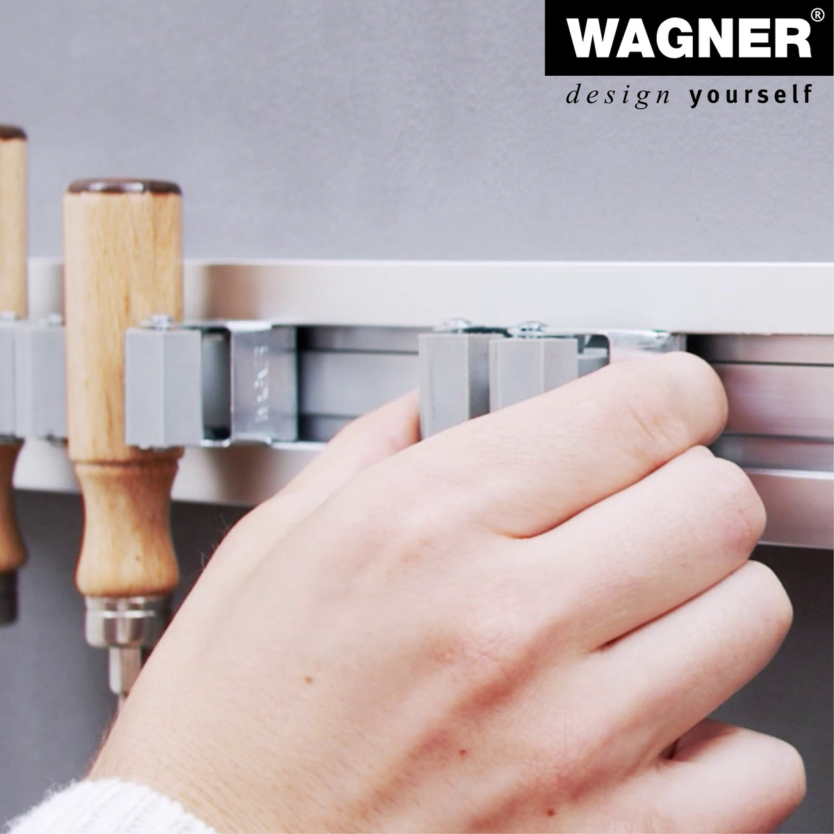 Garage garden tool storage organizer system by WAGNER, small hook for efficient tool organization.