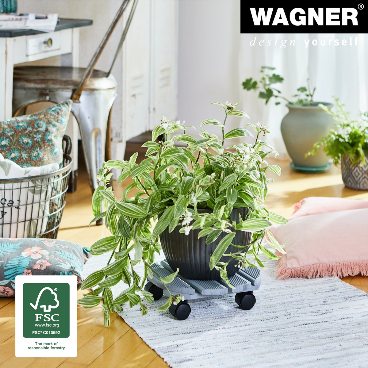 Wagner 11.4&quot; gray round ribbed indoor plant caddy with soft-wheel casters.