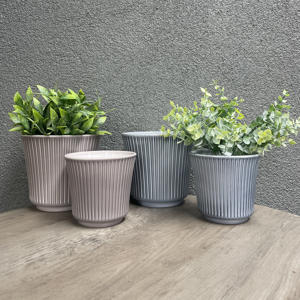 4-piece indoor ceramic plant pot set in blue-gray and warm-gray, featuring two 6.3&quot; and two 4.7&quot; pots on a wooden surface.