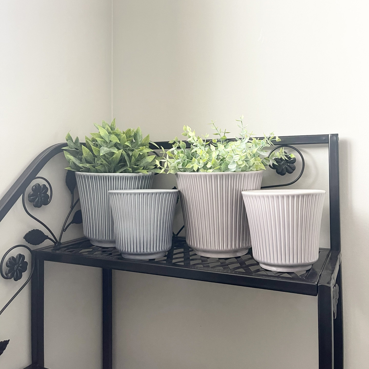 4-piece indoor ceramic plant pot set in blue-gray and warm-gray, featuring two 6.3&quot; and two 4.7&quot; pots on a shelf.