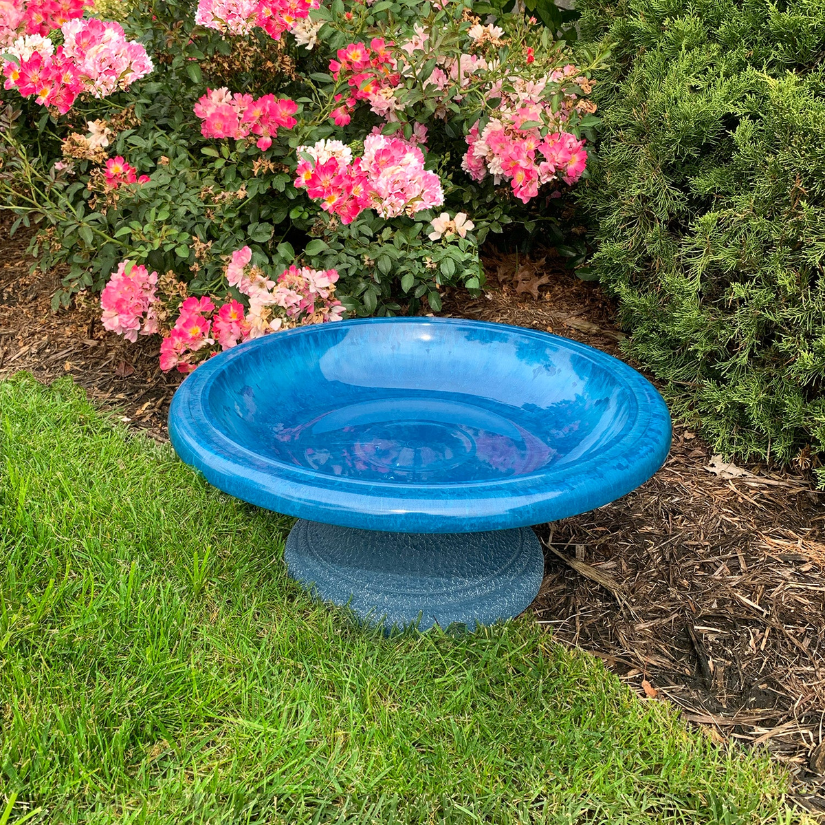 Azure Blue Fiber Clay Birdbath in garden setting, 19&quot; diameter, 7.5&quot; height.