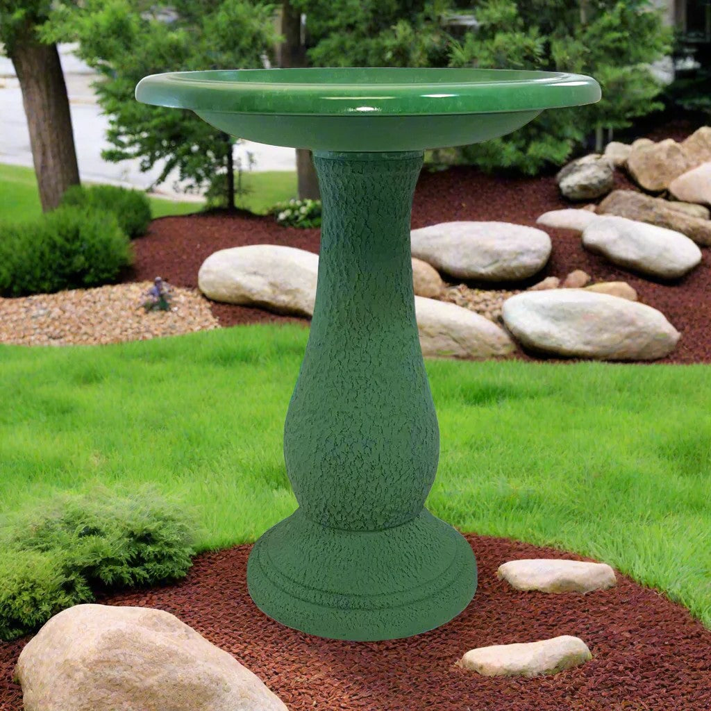 Kale green 24&quot; fiber clay birdbath in garden setting, ceramic-like finish.