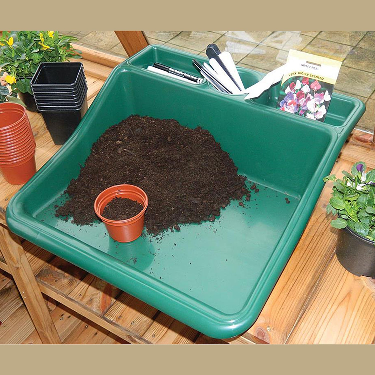 Compact green tidy tray with integrated shelf, 19&quot; size, ideal for gardening.