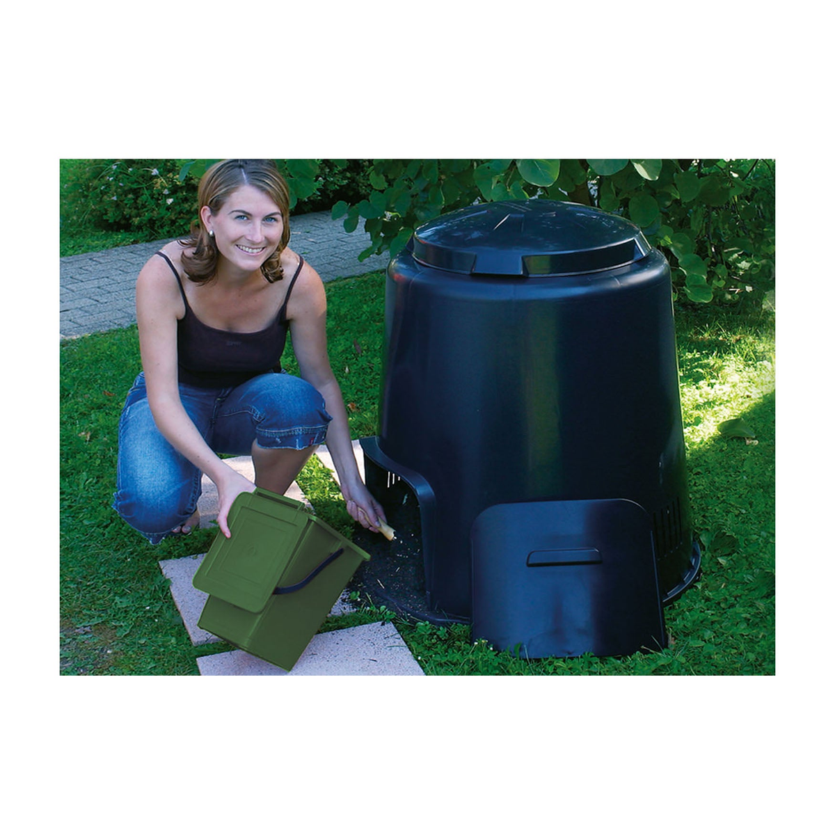 74 gallon capacity eco composter in use outdoors, made from recycled polypropylene with a rotating lid and bottom exit door.