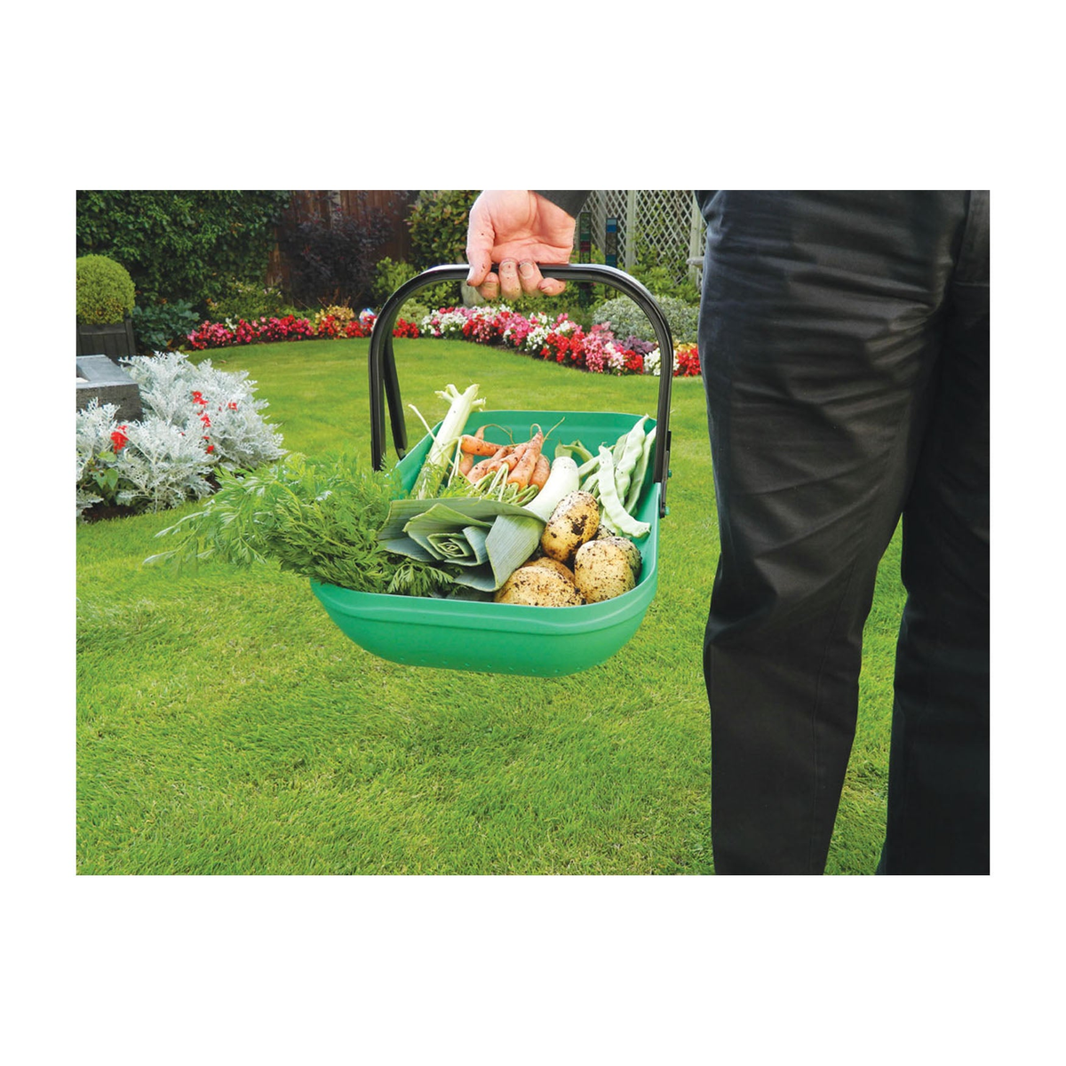 Green Colander Garden Trug with built-in drainage holes carrying harvested vegetables.