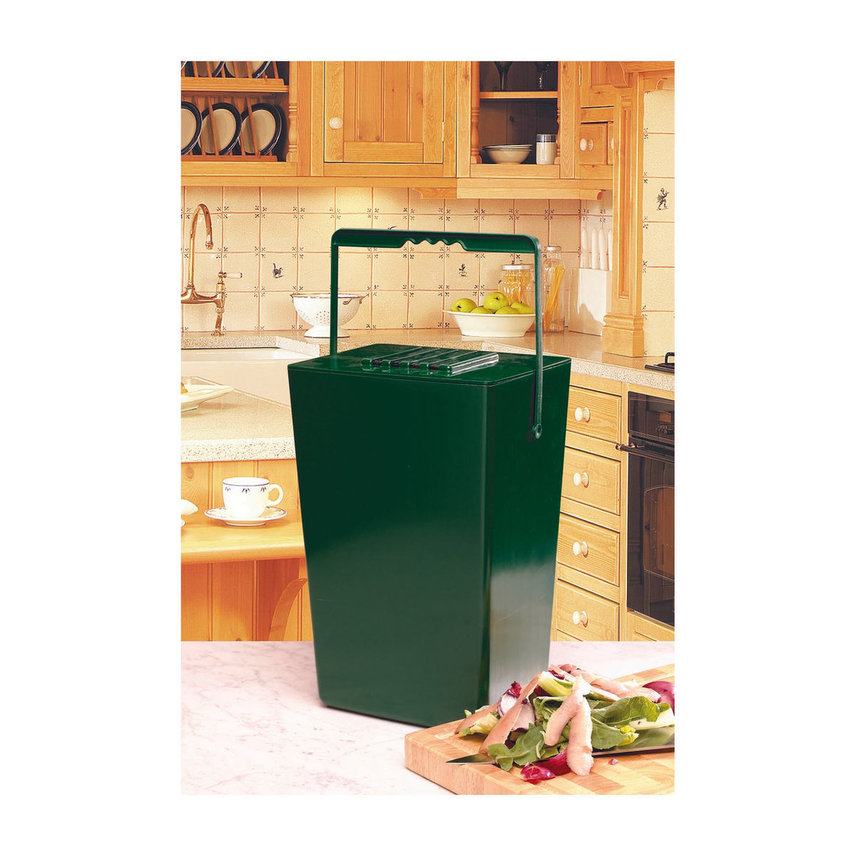 Midi Compost Caddy in a kitchen setting, 2.5-gallon capacity, made from recycled plastic with charcoal filter, 8.5&quot;W x 6.5&quot;D x 14&quot;H, ideal for composting in small spaces.