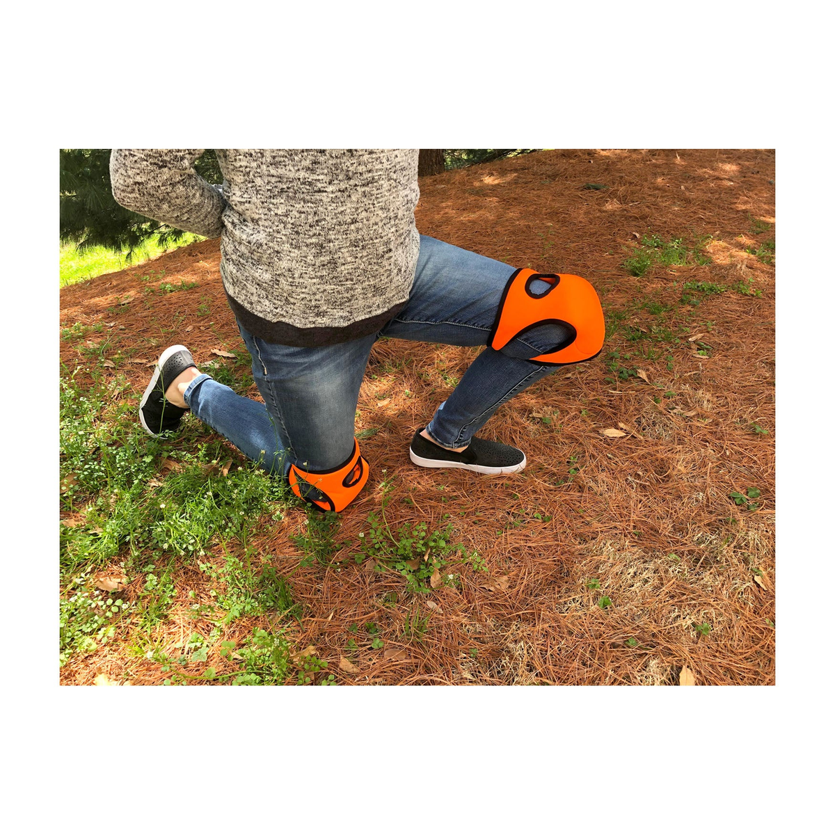 Orange memory foam knee pads for gardening with contoured neoprene design.