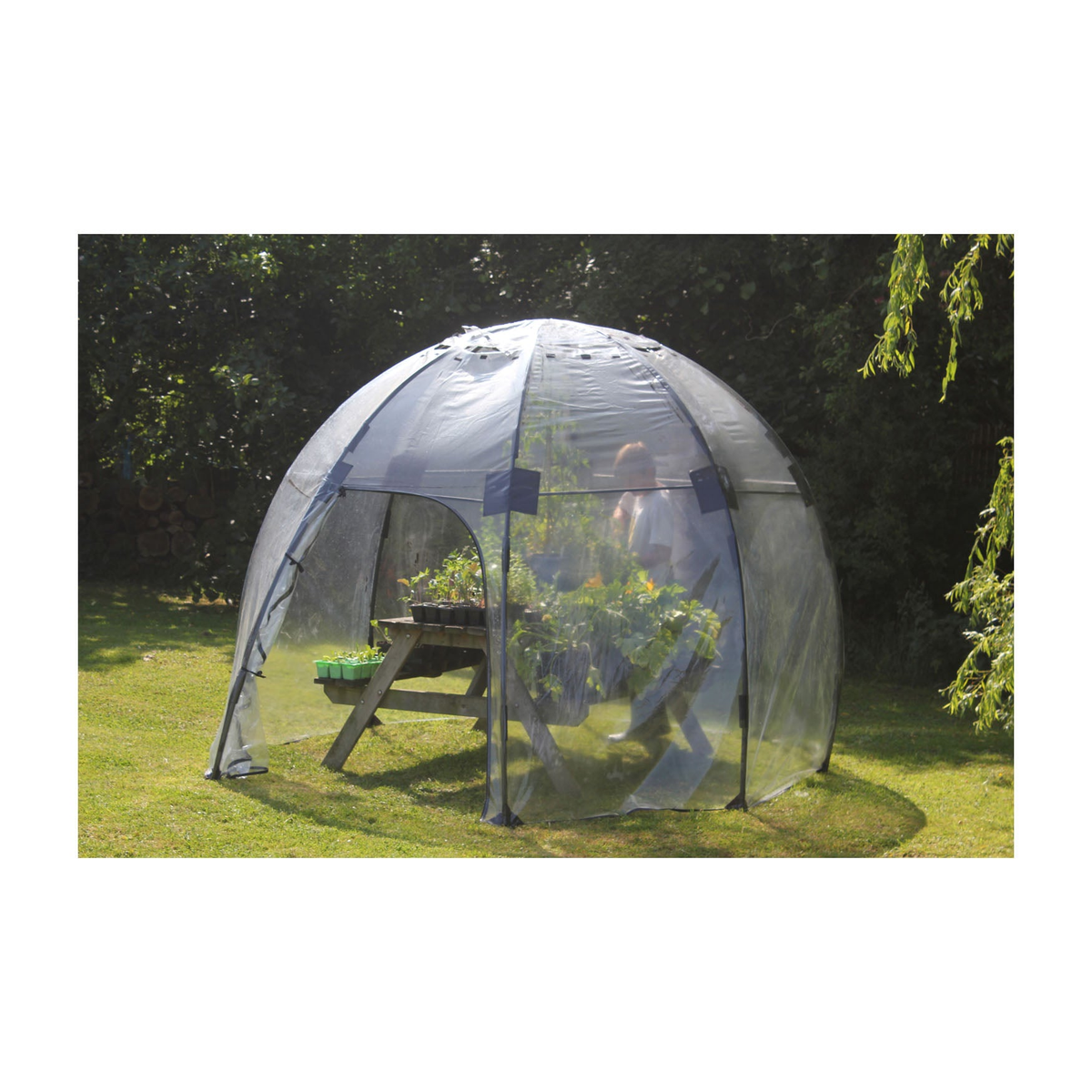 Standard Sunbubble Walk-In Greenhouse in garden setting, dome shape, UV PVC, fiberglass construction.