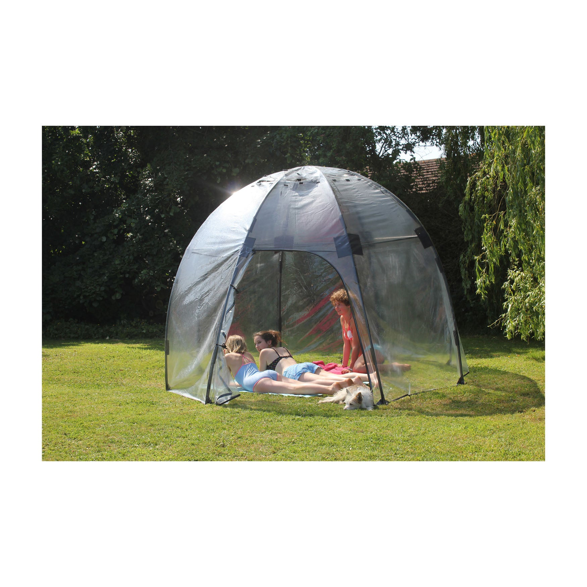 Standard Sunbubble Walk-In Greenhouse set up on lawn with people inside, showcasing dome shape and clear PVC construction.