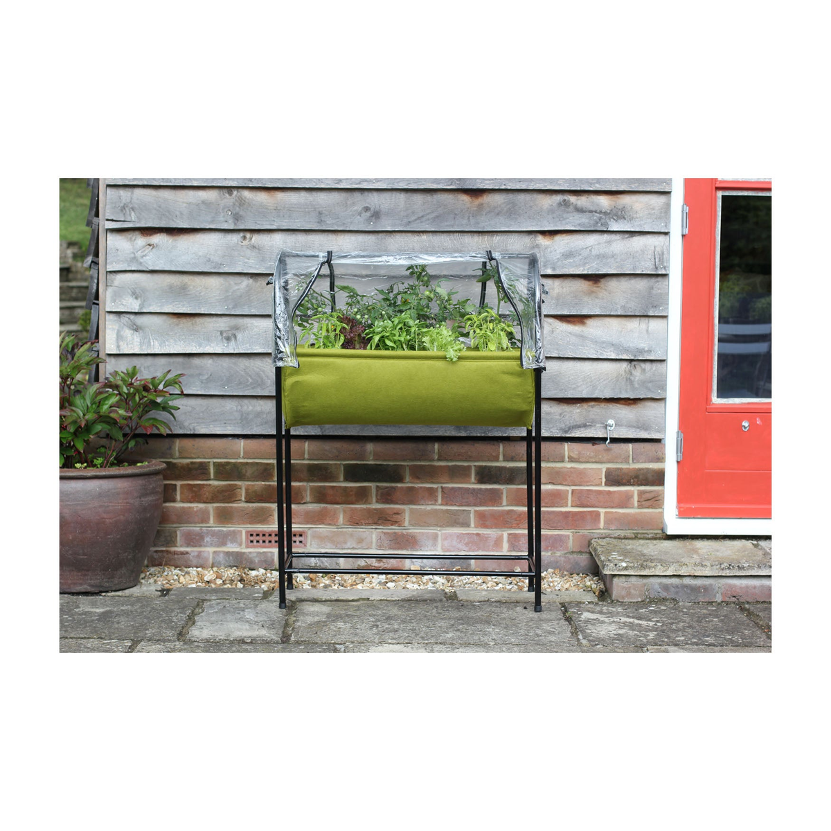 Vigoroot Easy Garden Table with self-watering planter and removable poly cover.