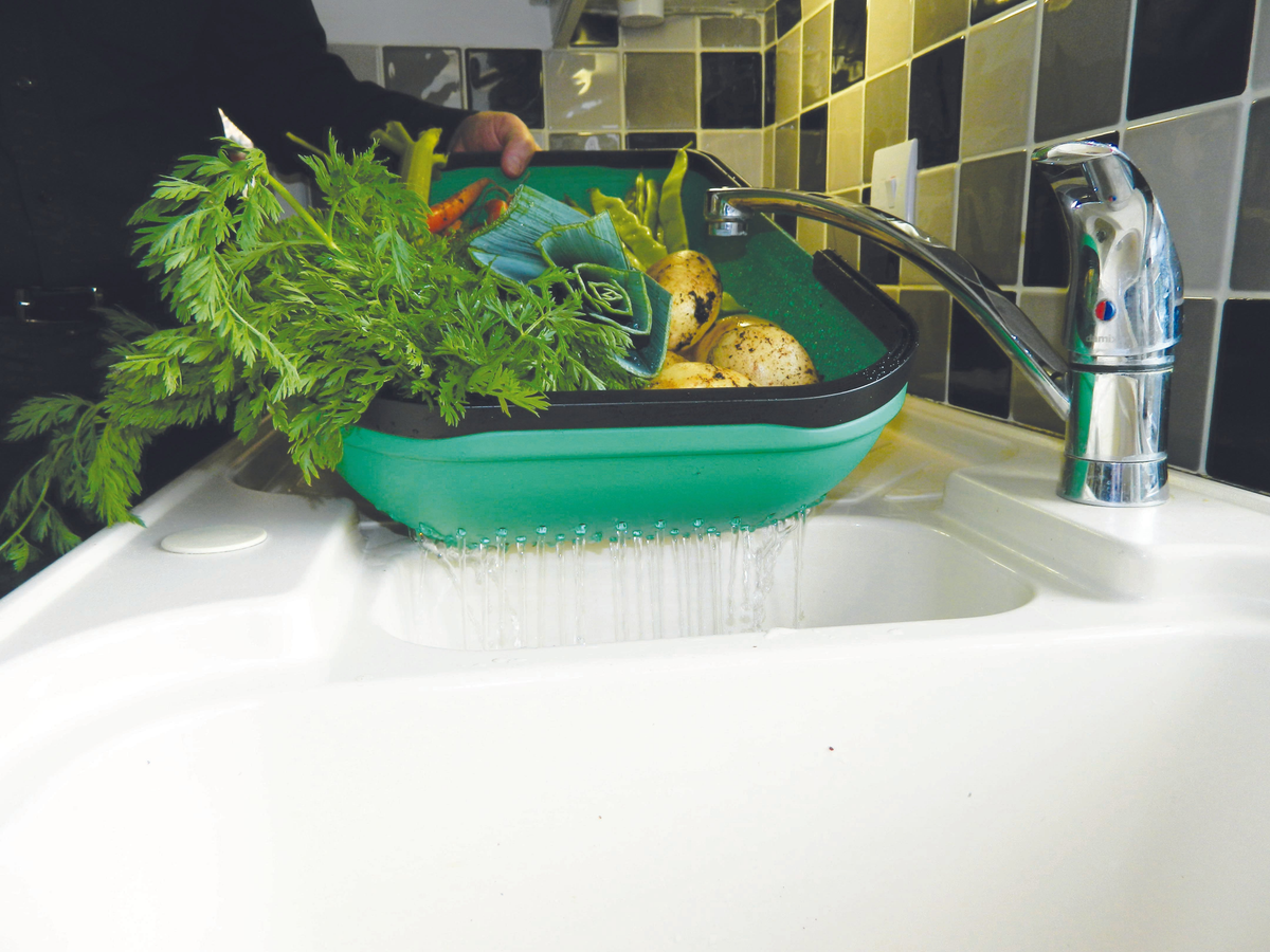 Green Colander Garden Trug washing vegetables in kitchen sink.