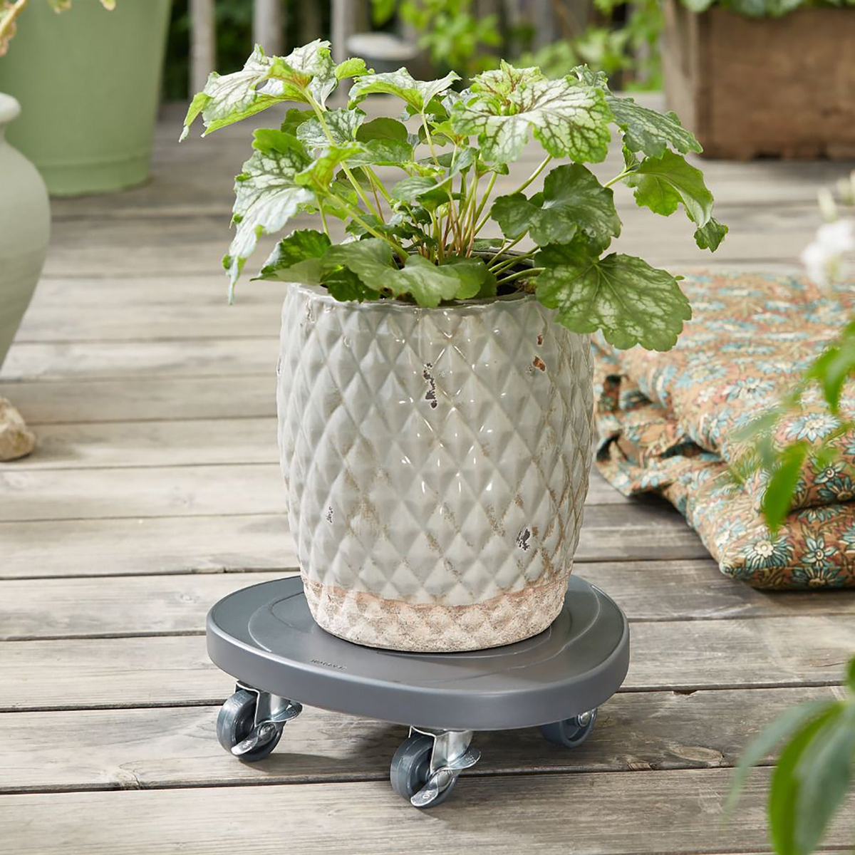 11&quot; charcoal round swirl stone plant caddy with brakes, supports 176 lbs, indoor/outdoor use.