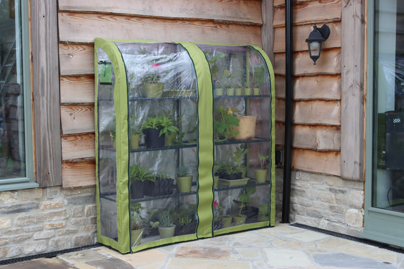 Double Light-Booster Plant House with reflective backing, enhancing plant growth by increasing light exposure.