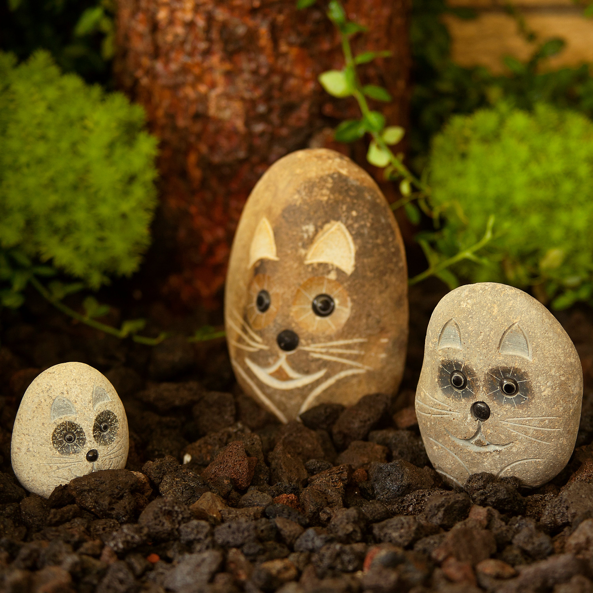 Hand-carved natural granite boulder stone cat sculptures; three-piece set featuring small (4&quot;), medium (6&quot;), and large (8&quot;) sizes; eco-friendly garden decor.