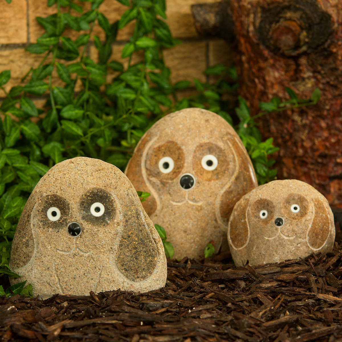 Hand-carved granite boulder stone dogs, 3-piece set in garden setting, 4&quot;, 6&quot;, 8&quot; sizes.