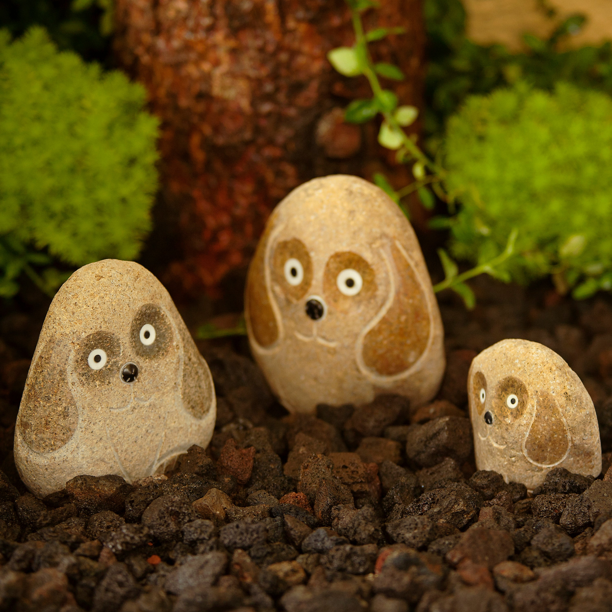 Hand-carved natural granite boulder stone dogs set; three pieces (4&quot;, 6&quot;, 8&quot;) in garden.