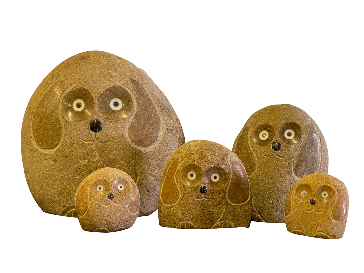 Hand-carved granite boulder dog sculptures, 5-piece set, various sizes, unique garden decor.