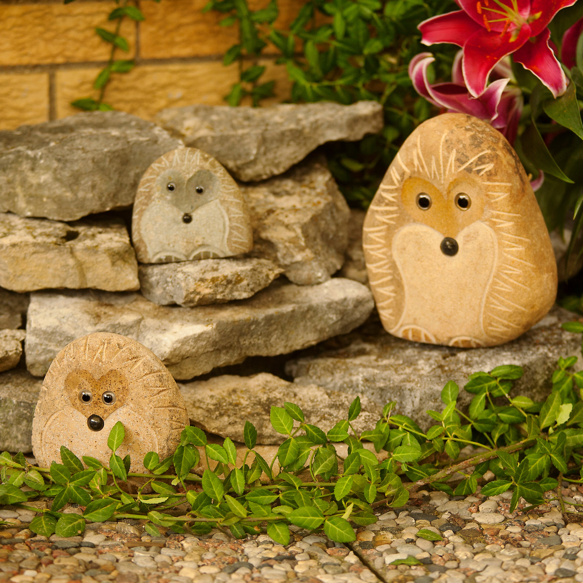 Hand-carved granite boulder hedgehog family set; includes three sizes: 4&quot;, 6&quot;, and 8&quot;, perfect for garden decor.