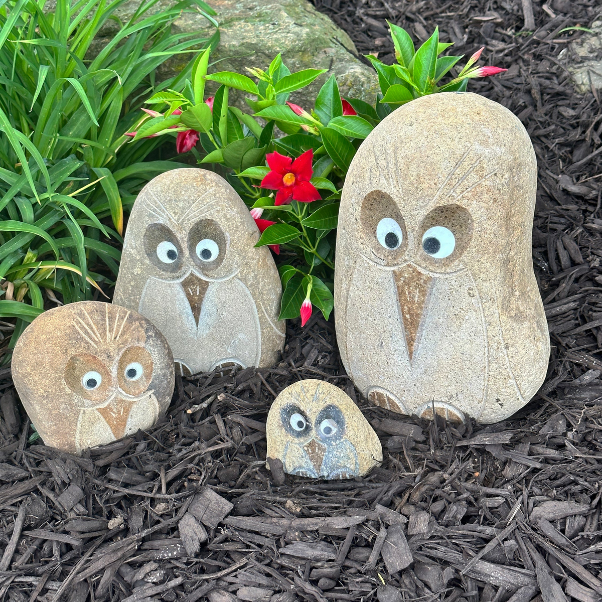 Hand-carved granite boulder angry bird sculptures with quartz eyes, set of four sizes for garden decor.