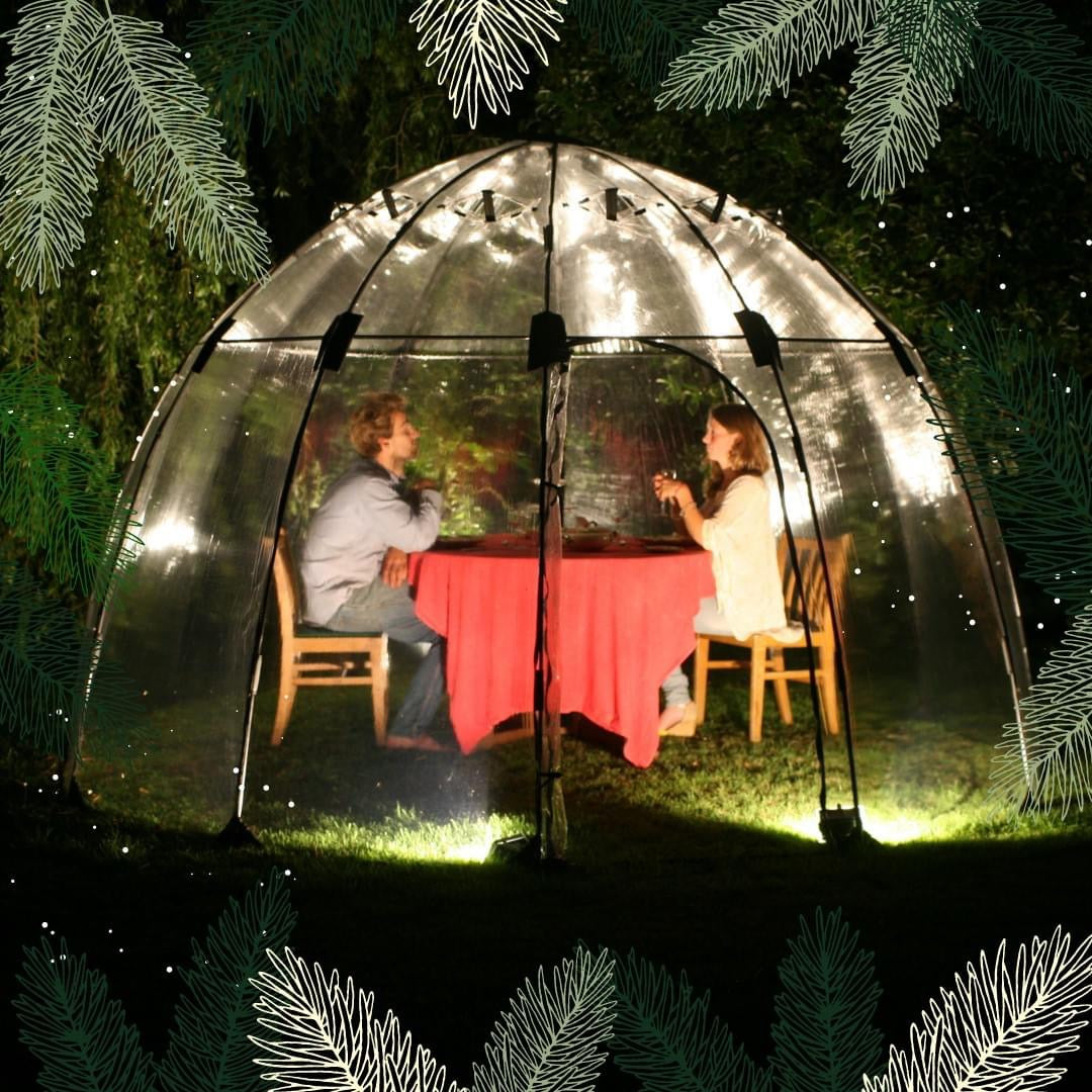 Standard Sunbubble walk-in greenhouse with dome shape, featuring UV-stabilized PVC, flexible fiberglass rods, and ambient lighting, set in a garden.