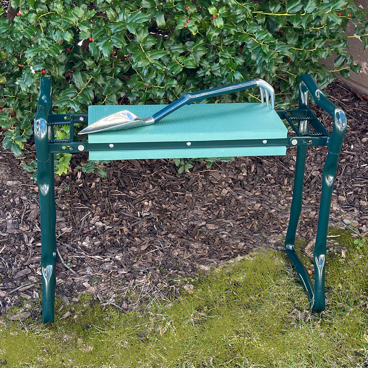 Gardening Kneeler Seat with Trake tool, foam pad, foldable design, green color, outdoor use.