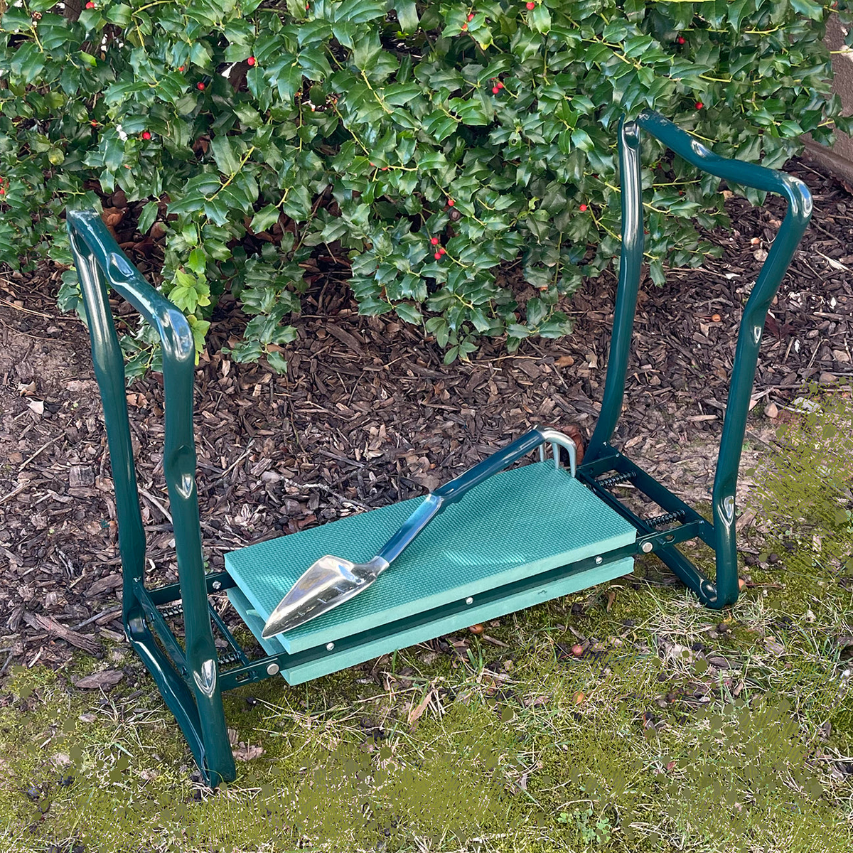 Gardening kneeler seat with foam pad and folding legs, includes a Trake tool, ideal for comfortable gardening.