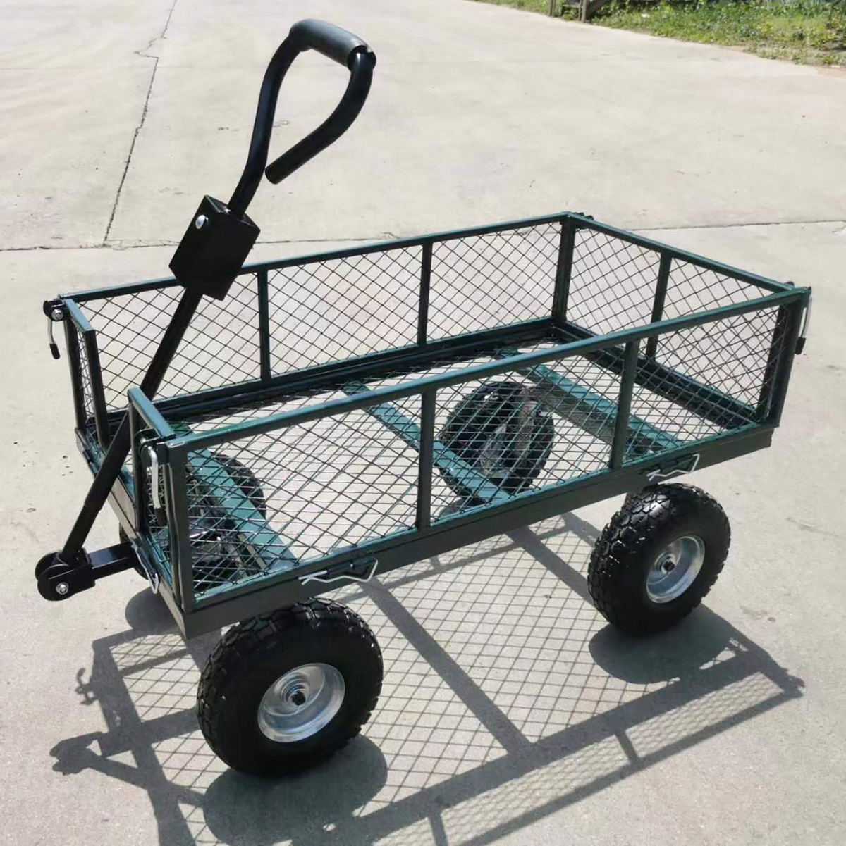 Small Steel Mesh Garden Wagon with Foam Wheels on cement surface.