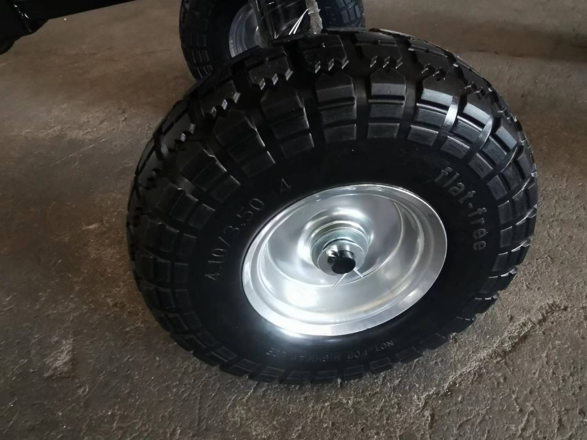 Foam wheel of the Small Steel Mesh Garden Wagon for easy maneuvering.