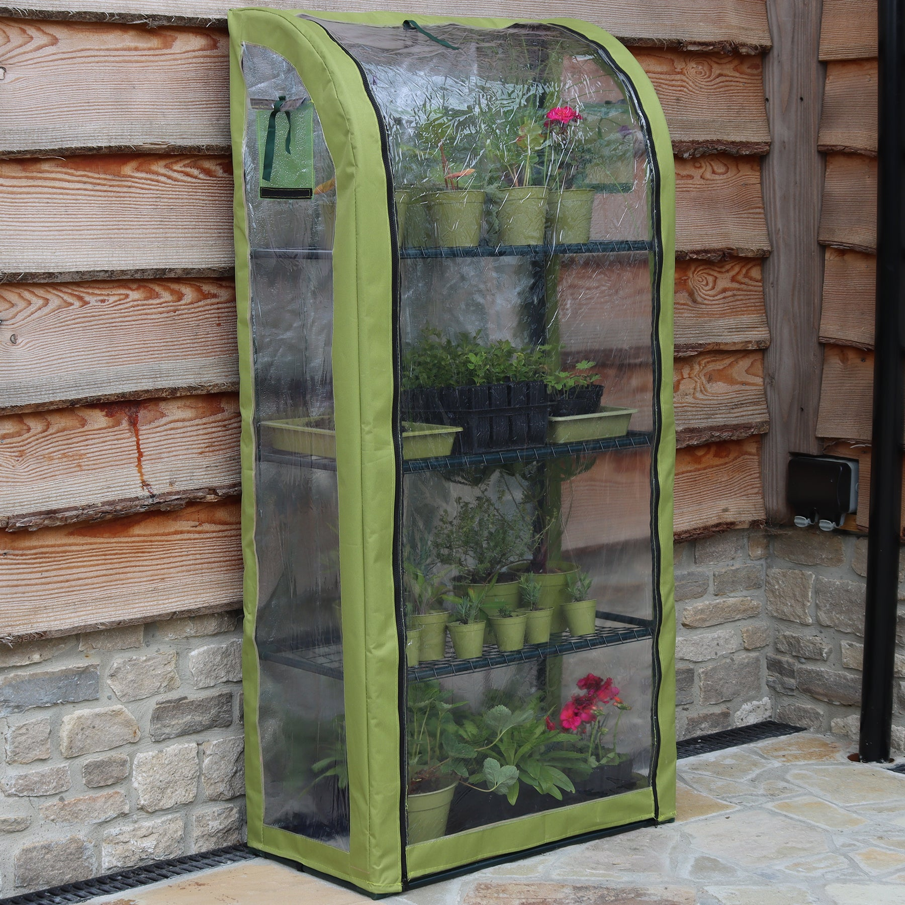 Single Light-Booster Plant House with reflective backing and zippered front, ideal for potted plants.